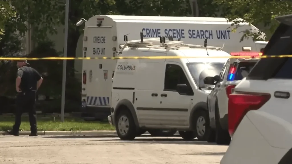 Police tape around a pickup truck near where Columbus officers arrested a teen suspect