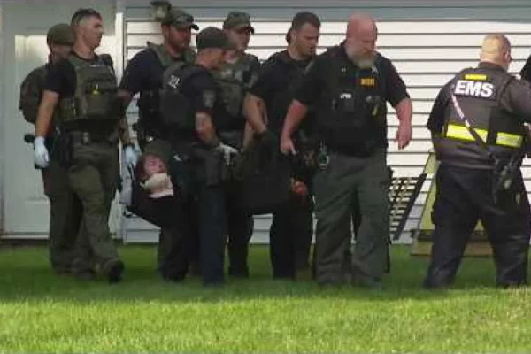 Police tape and emergency lights after an officer was stabbed during a trespass response in Ohio