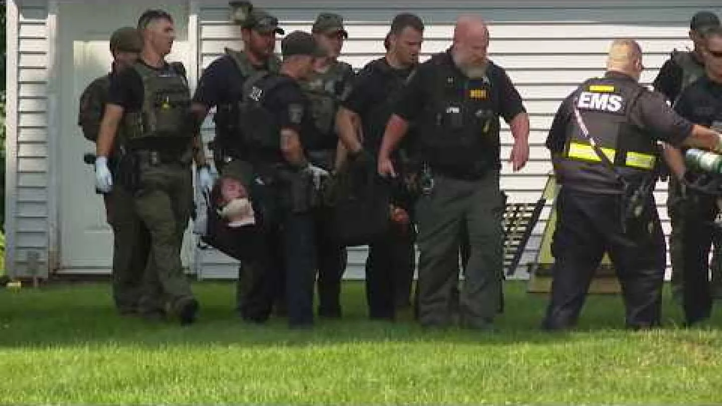 Police tape and emergency lights after an officer was stabbed during a trespass response in Ohio