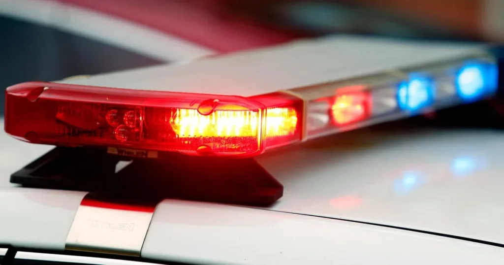 Texas DPS vehicle at a crash scene near a highway barrier