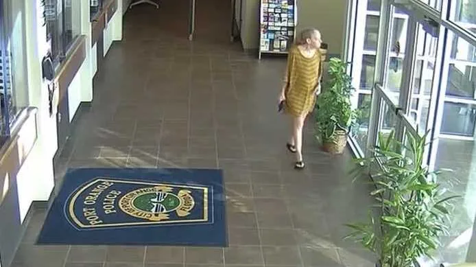 Police released video showing an armed woman at the Port Orange police station before officers opened fire