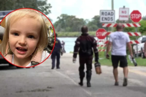 Police and search crews near a waterside landing during the search for Saylor Hayes