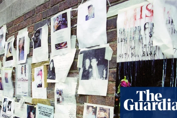 Missing-person posters from Sept. 11 displayed on translucent panels inside a Brooklyn church