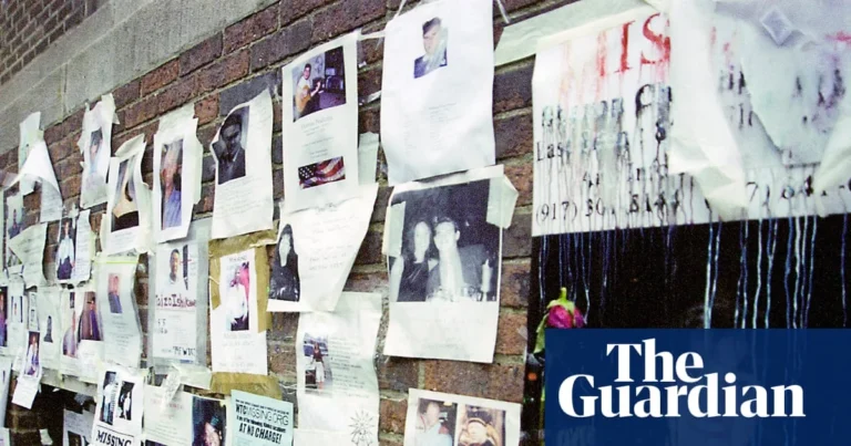 Missing-person posters from Sept. 11 displayed on translucent panels inside a Brooklyn church