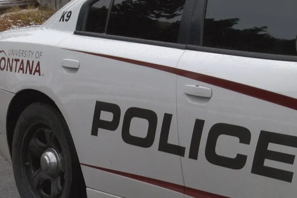 University of Montana campus police vehicle near a residence hall in Missoula