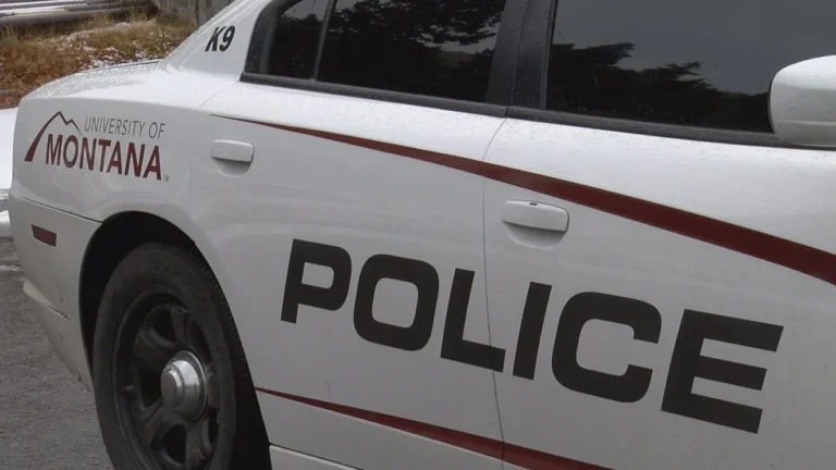 University of Montana campus police vehicle near a residence hall in Missoula