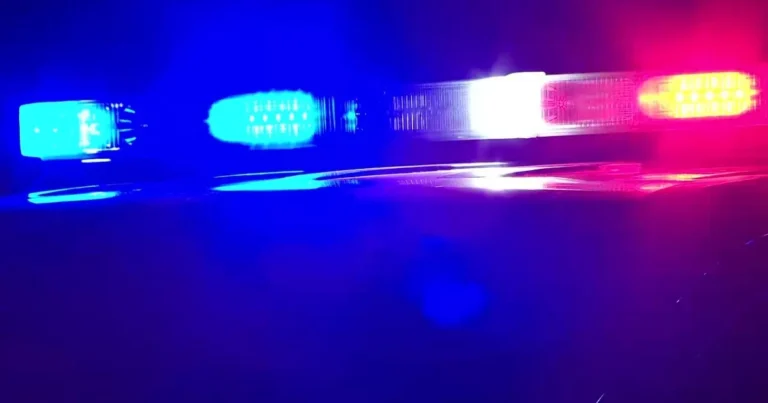 Police officers gather after a deadly shooting that killed one Columbia officer and wounded another