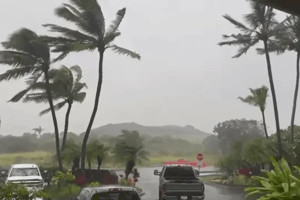 Jeff Harrington in Poipu, Hawaii, preparing for Hurricane Lowell as rain and wind build
