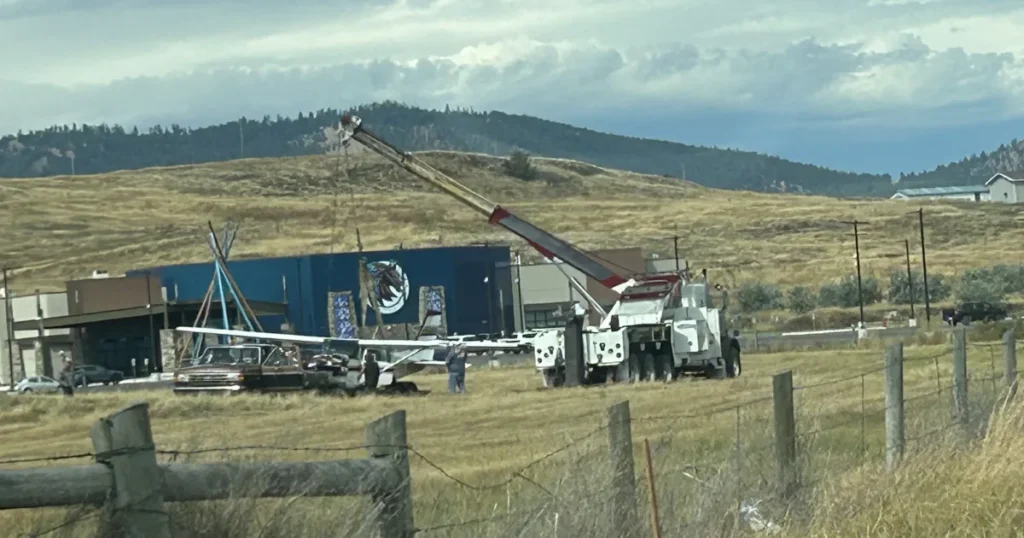 Small airplane on an airport field after crash-landing with visible damage in Polson, Montana