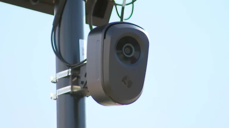 A Massachusetts State Police cruiser near a license plate reader camera