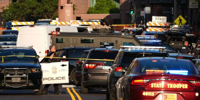 Police respond outside Shoreline Plaza apartment building in downtown Minneapolis after a deadly shooting
